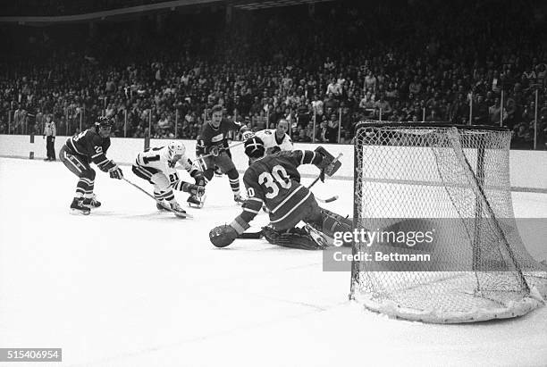 Black Hawks' Stan Mikita watches as the puck slams into the net after beating Canucks' goalie Cesare Maniago during the third period of the game...