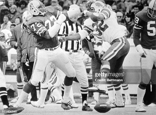 Buffalo Bill, O.J. Simpson, fights with New England Patriot, Mel Lunsford, early in the first quarter of today's game in Foxboro. Simpson was ejected...
