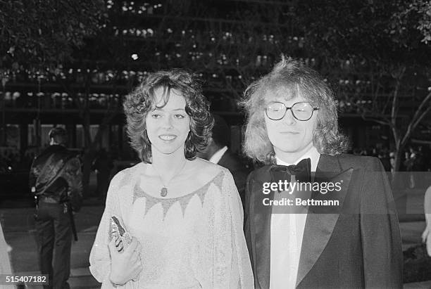 Actress MacKenzie Phillips and her escort, record producer Peter Asher, arrive for Academy Awards presentations.