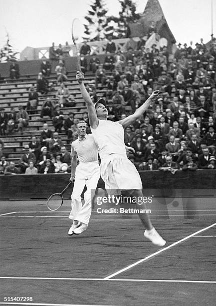 Auteuil, France- The queen of the courts had to wave her sceptre quite high to reach for this ball during the finals of the French Mixed Doubles...