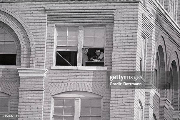 Police sharpshooters fired live ammunition into sand bags from the same window of the Texas School Depository that accused assassin Lee Oswald fired...