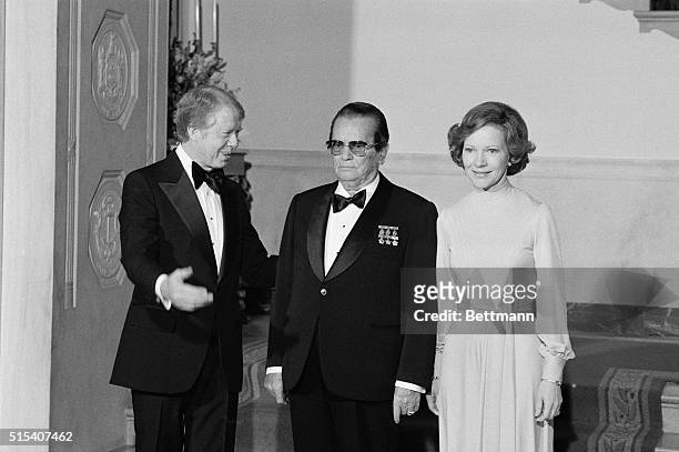President Carter escorts President Josip Broz Tito and Mrs. Carter into the State Dining Room for a State Dinner in honor of the Yugoslavian leader...