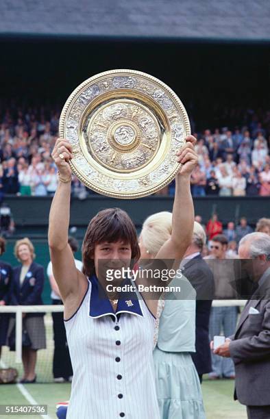 Wimbledon, England: Martina Navratilova of USA holds up Women's Singles trophy at Wimbledon after defeating Chris Evert. July 7, 1978.