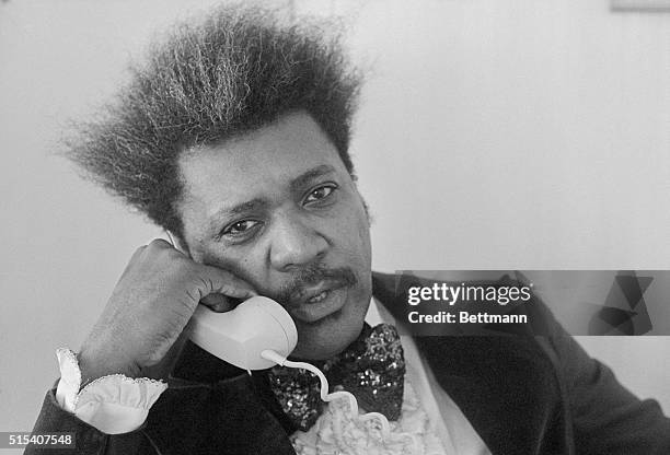 Miami Beach, Florida: Fight promoter Don King chats with a reporter in his hotel room prior to leaving for the convention center. The U.S. Boxing...