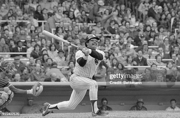 New York: Reggie Jackson action in the fourth inning as he had two hits on opening day and scored two runs for the New York Yankees here at Yankee...