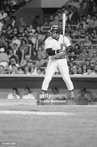 New York Yankees' Reggie Jackson at the plate poised to bat against the Oakland A's.