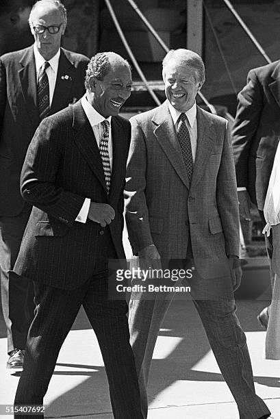 Pictuer shows US President, Jimmy Carter, walking with Egyptian President, Anwar Sadat. Undated photo.