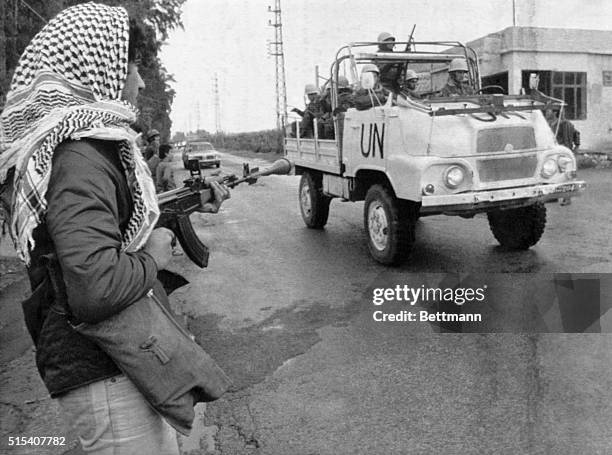 Tyre, Lebanon: Palestinian guerrillas, armed with a grenade-mounted Soviet made AK-47 machine gun, stands guard March 24th on the outskirts of this...