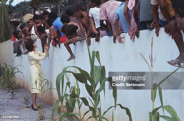 Rosalynn Carter is shown here as she greets children in Brazil.