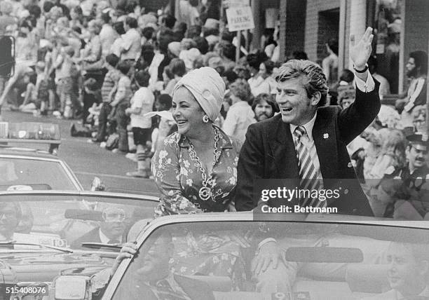 Liz Taylor and her husband, John Warner, greet an enthusiastic crowd at the 28th Annual Charlottesville Dogwood Grand Feature Parade. The two were...