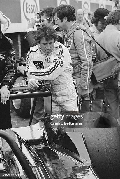 Could Win..." Zolder, Belgium: Racing driver Mario Andretti of Nazareth, Pa., seems to be seeking a moment of solitude during all the excitement at...