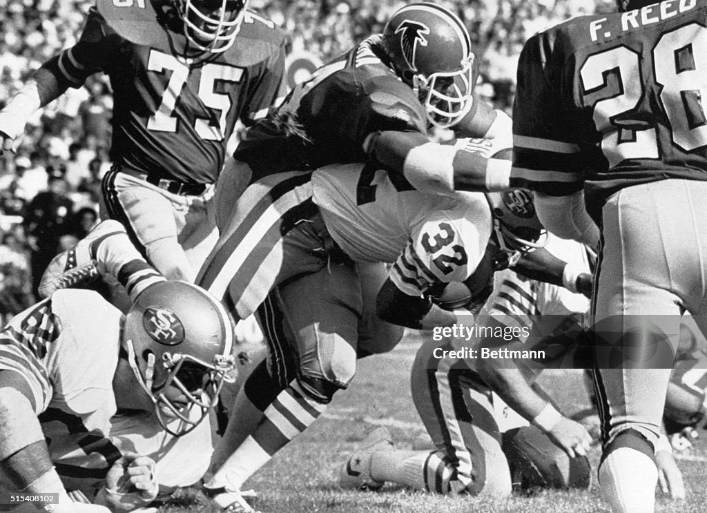 O.J. Simpson is Tackled by Falcon's Defense