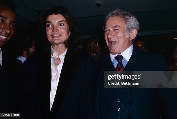 Jacqueline Kennedy Onassis is shown chatting with author Norman Mailer.