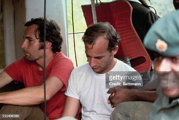 Two members of the People's Temple are held in custody in Georgetown, Guyana, on November 22, 1978 following the Jonestown massacre. At left is...