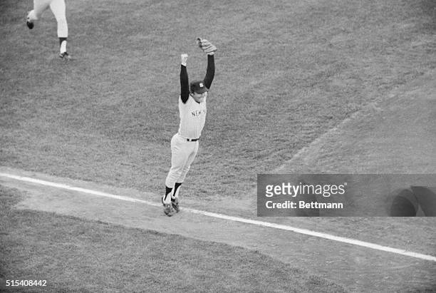 Graig Nettles, New York Yankees third baseman, leaps for joy after catching Carl Yastrzemski's pop-up to end the game and give the Yanks a 5-4...