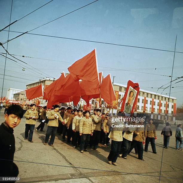 Peking, China-: Red guards parade through street carrying a portrait of Mao Tse-Tung and red flags. BPA2