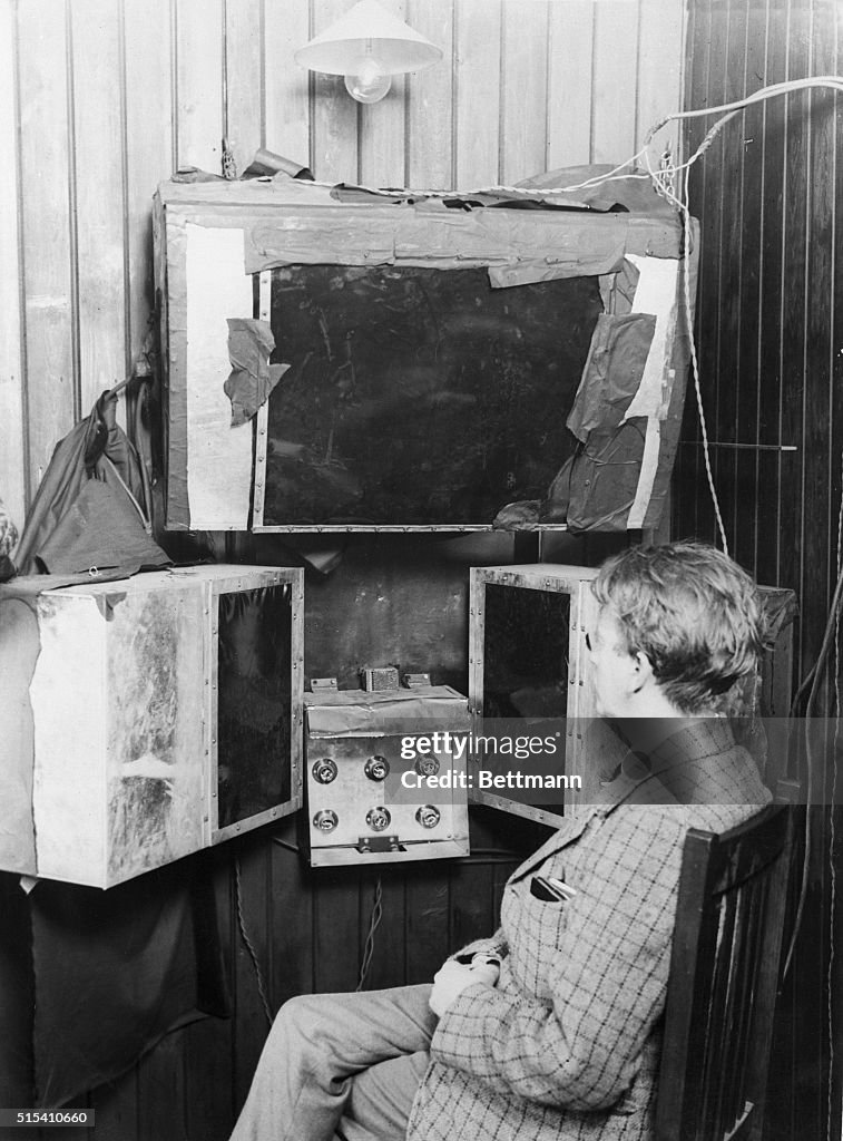 Tv Invention London, England- John L. Baird sits in front of the apparatus with ...