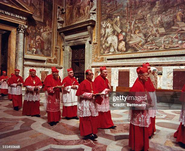 The procession of the Sacred College of Cardinals file into the Sistine Chapel where they will be locked inside to begin the conclave to elect a...