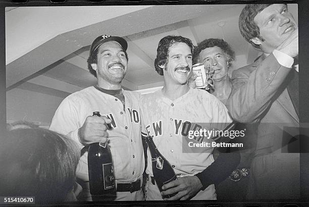 Los Angeles: Reggie Jackson, whose homer helped sink the Dodgers 7-2 in the sixth and final game of the World Series, celebrates with Yankee pitcher...