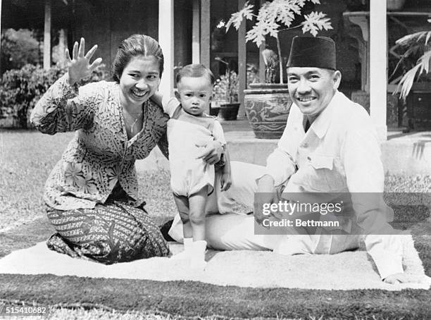 Batavia, Java, Indonesia- Dr. I.R. Sukarno, Nationalist leader and President of the Indonesian government, with his wife and son, Guntur, shown at...