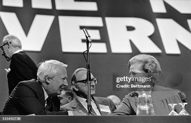 Brighton, England- Conservative Party leader, Margaret Thatcher, shakes hands with former Premier, Edward Heath, on the platform at the Conservative...