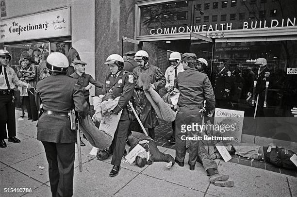 Police carry demonstrators out of the office building containing the Washington offices of Kerr-McGee during a demonstration 11/13 to protest what...