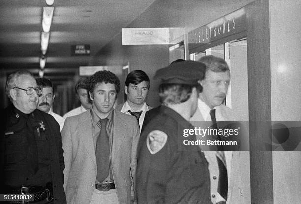 Dan White suspect in the killing of San Francisco Mayor George Moscone & Supervisor Harvey Milk is led by police officers towards jail elevator at...