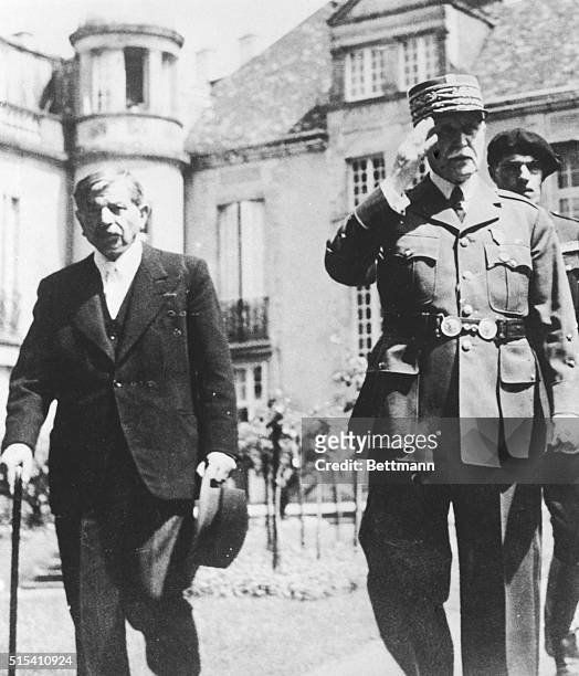 Vichy, France- This photo, published in a German propaganda magazine, shows Pierre Laval, France's Iscariot, with Marshal Petain, 81-year-old Chief...