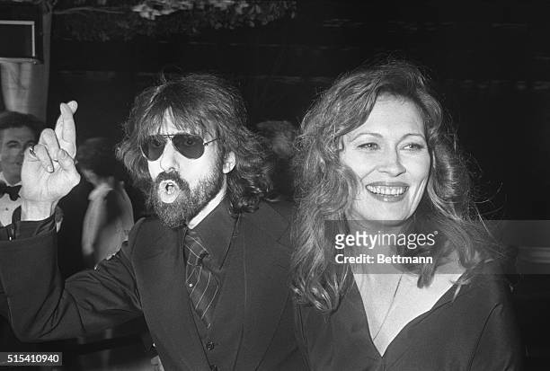 Hollywood, CA- Actress Faye Dunaway, nominated for Best Performance by an Actress in a Supporting Role in the 49th Annual Academy Awards, smiles...