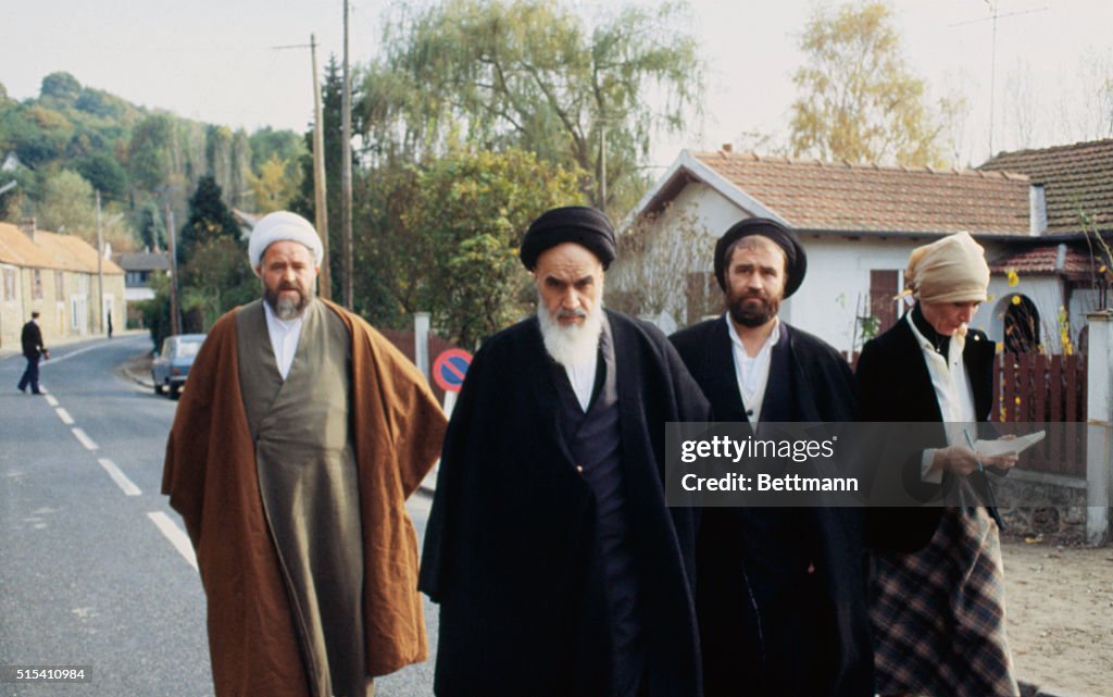 Ayatollah Ruhollah Khomeini Walking with Colleagues