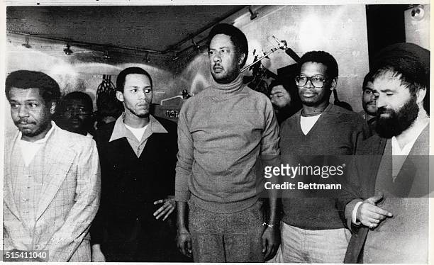 Teheran, Iran- The Ayatollah Khomeini's son, Syed Ahmad , is shown with five of the ten hostages released from the U.S. Embassy at Mehrabad Airport....