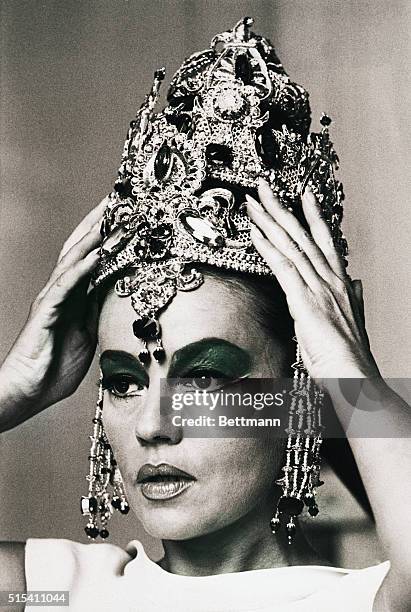 Jeanne Moreau prepares to go into her dance as "Mata Hari, Agency H-21," a recent film written for her by Francois Truffaut. Filed 6/6/1970.