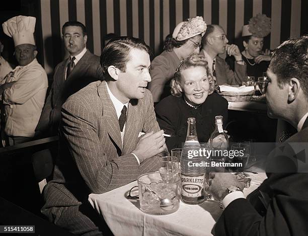 Hollywood, CA-: Leaving their two boys at home, Gregory Peck, and his wife Greta, join friends for an evening of fun at the opening of a new show at...