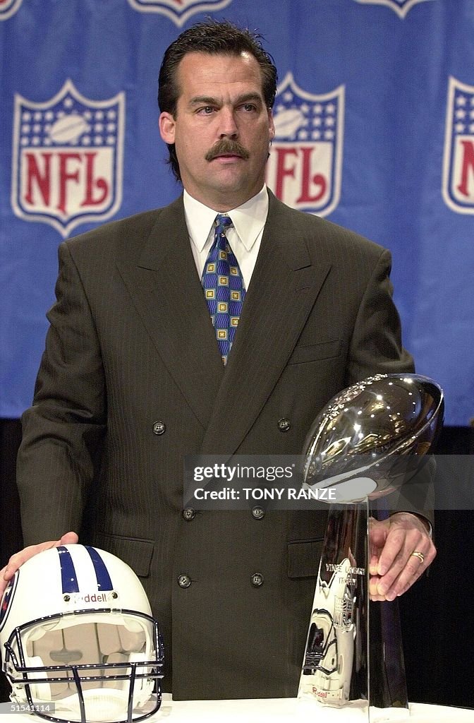 Tennessee Titans head coach Jeff Fisher poses with the Lombardi... News