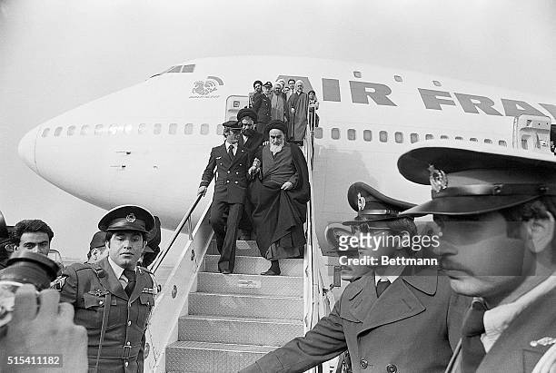 Tehran, Iran- Ayatollah Ruhollah Khomeini, Iran's main opposition leader, is shown stepping down the Air France plane which brought him to Tehran...