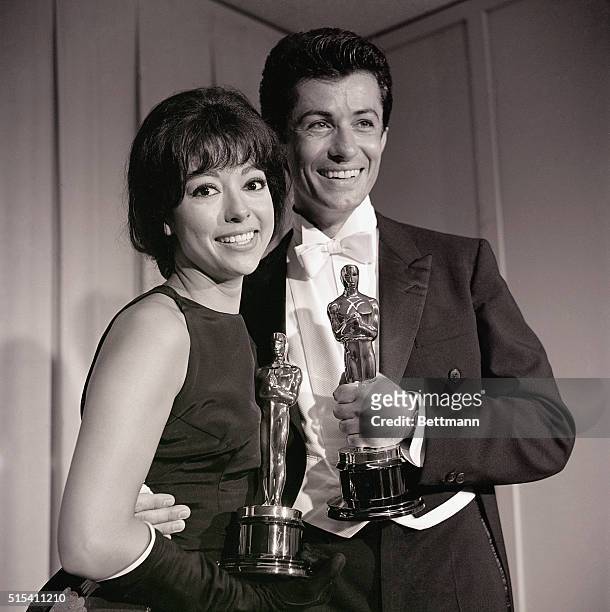 Santa Monica, California-: Actress Rita Moreno, "Best Supporting Actress" and George Chakiris, "Best Supporting Actor," are shown with their Oscars...