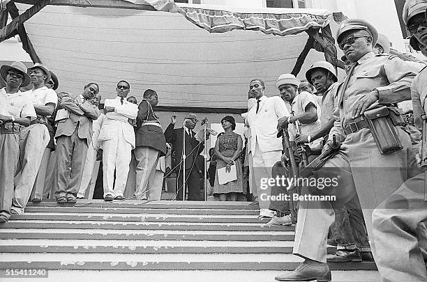 Port-au-Prince, Haiti-: Ex-President Francois Duvalier addresses the public from the porch of the Presidential Palace, as armed soldiers and...