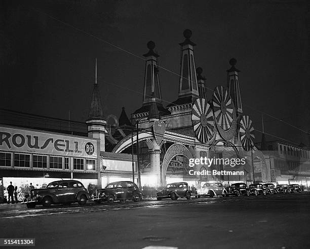 New York, New York-: The ornate facade of the Luna Park entrance, once gay with brilliantly lighed windmills and crescents, now looms darkly above...