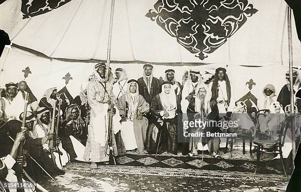 Emir Faisal, later King , son of King Ibn Sa'ud of Arabia and leader of his father's armies, holds an audience with his warriors in his tent.