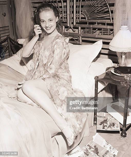 Paris, France-: Starring in the play "Cat On a Hot Tin Roof," shapely French actress Jeanne Moreau shows off the rather sexy costume in which she...