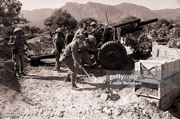 Kyrenia, Cyprus: Turkish troops dig in at a gun position near here 7/23 after cease-fire.