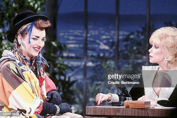 Hollywood, California: Joan Rivers interviews pop musician Boy George, of Culture Club, on "The Joan Rivers Show." Rivers, appears to be making a...