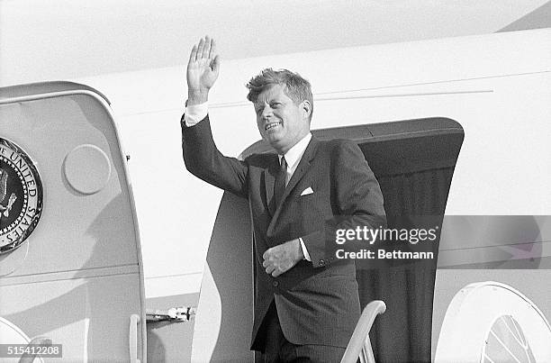 Berlin, Germany-: President John F. Kennedy waves goodbye as he leaves Berlin for Ireland.