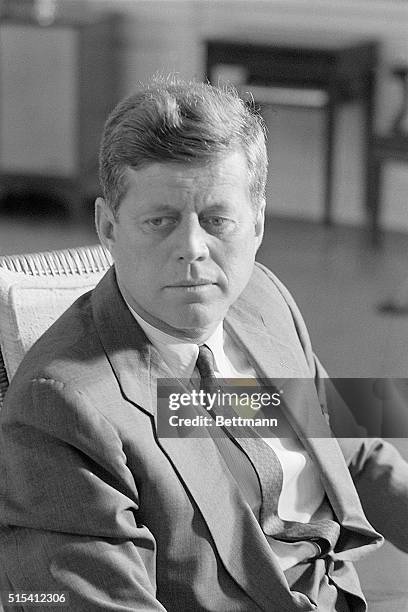 Washington, DC-: A serious looking President Kennedy is shown in his office while meeting with Portugese Foreign Minister Nogueira. The President met...