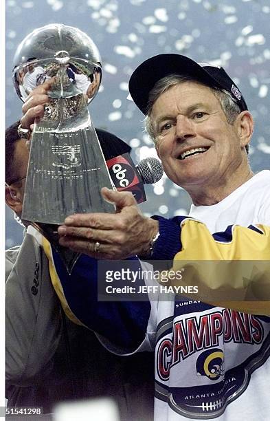 St. Louis Rams head coach Dick Vermeil holds the Vince Lombardi trophy after the Rams beat the Tennessee Titans 23-16 in Super Bowl XXXIV at the...