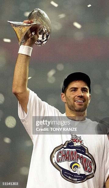 St. Louis Rams quarterback Kurt Warner holds the Lombardi Trophy after the Rams defeated the Tennessee Titans 23-16 in Super Bowl XXXIV at the...