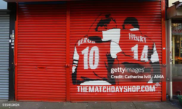 An image of Dennis Bergkamp and Thierry Henry of Arsenal on the shutter of the Matchday merchandise shop close to the stadium after the Emirates FA...