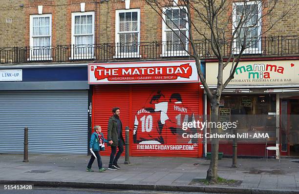 An image of Dennis Bergkamp and Thierry Henry of Arsenal on the shutter of the Matchday merchandise shop close to the stadium after the Emirates FA...