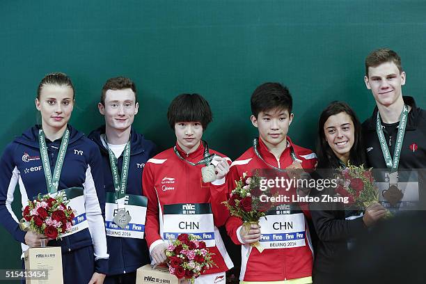 Silver medalists Benjamin Auffret and Laura Marino of France, Gold medal Chang Yani and Tai Xiaohu of China, bronze medal Meaghan Benfeito and...