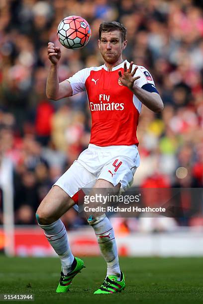 Per Mertesacker of Arsenal in action during The Emirates FA Cup Sixth Round match between Arsenal and Watford at the Emirates Stadium on March 13,...
